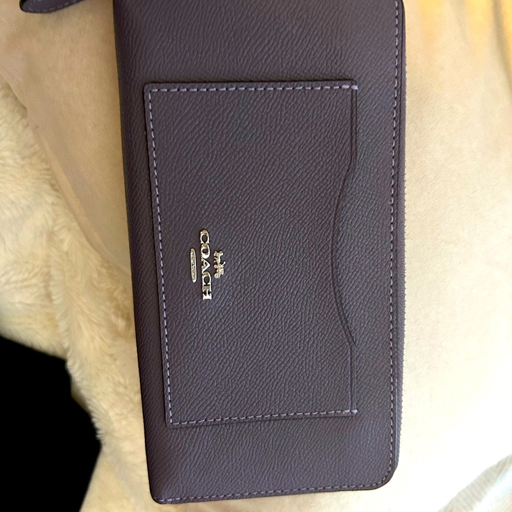 Authentic Coach Wallet in a beautiful Mauve color.  Excellent condition.